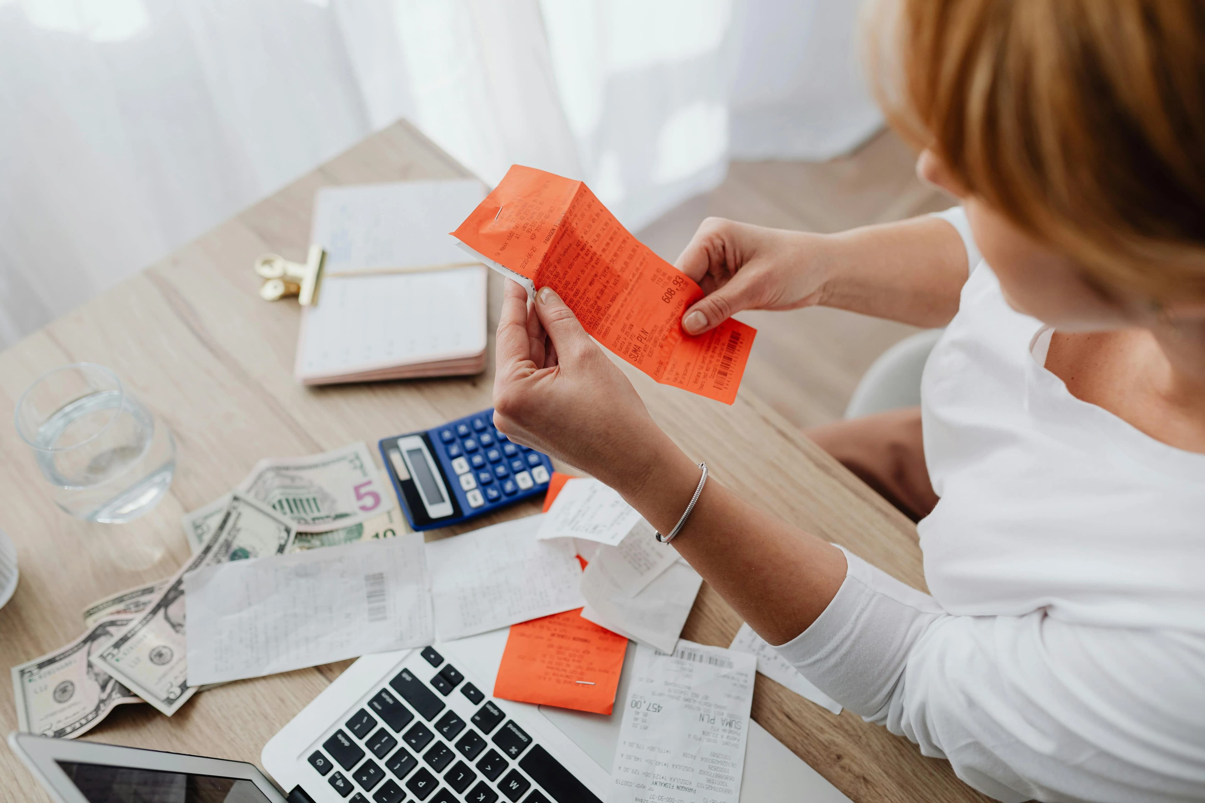 Woman organizing receipts and finances